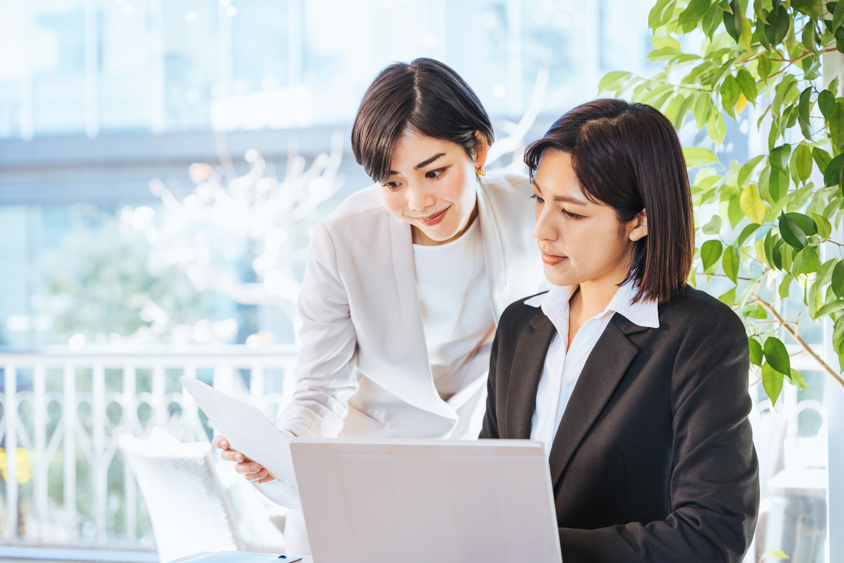 Two women (business image) who work after consultation